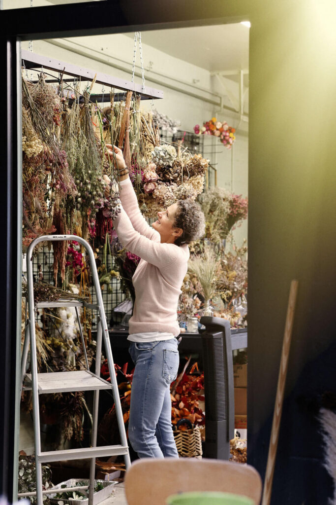 Melissa Olson of Penflora arranges flowers